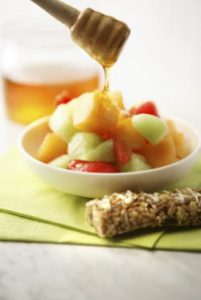 Raw Honey on fruit salad